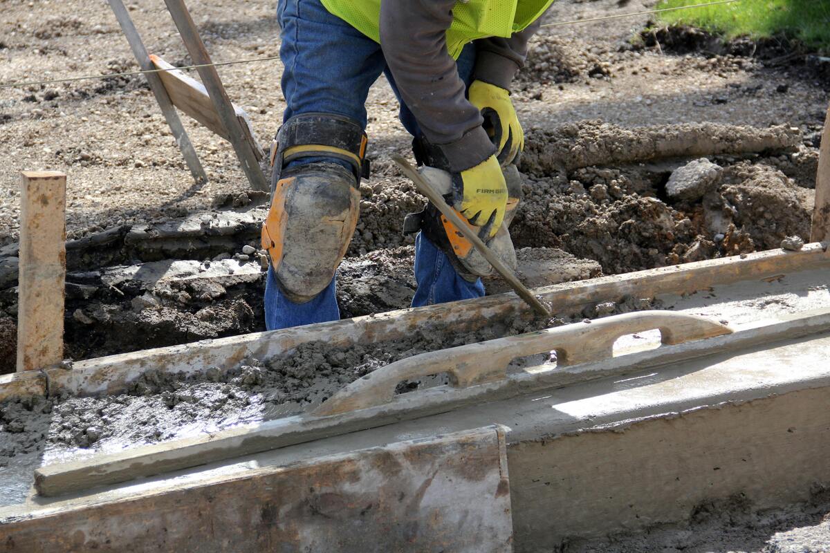 Person leveling concrete